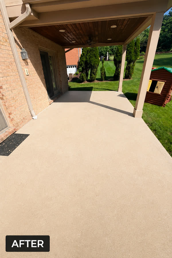 Same patio after pressure washing — clean, restored concrete