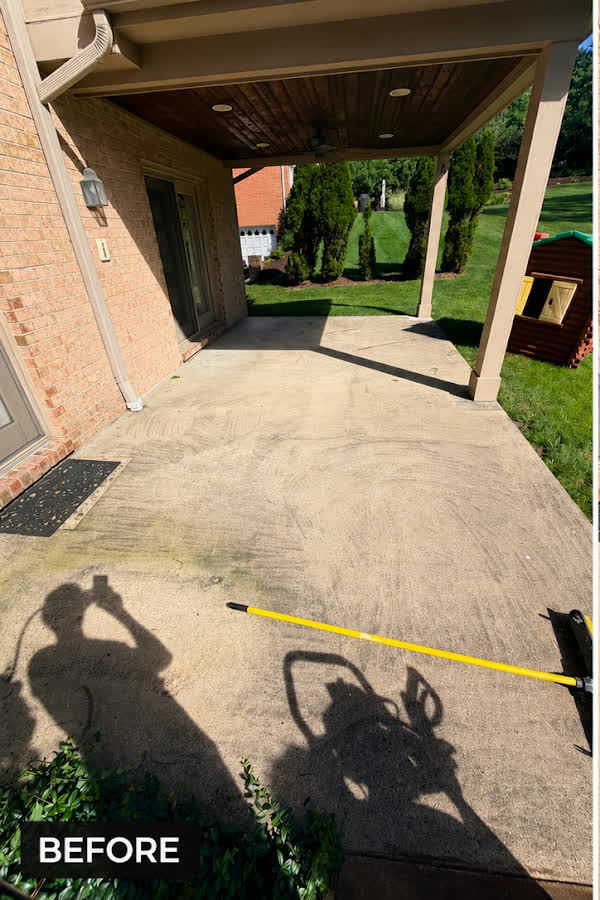 Patio before pressure washing — stained and dirty concrete